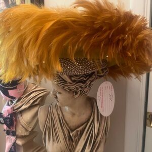 Elegant Feathered Hat with Rhinestone Band